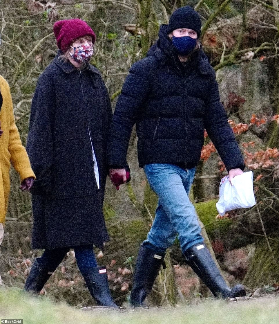 Winter outing: Taylor Swift and Joe Alwyn looked adorable as they were holding hands during a stroll in London on Monday